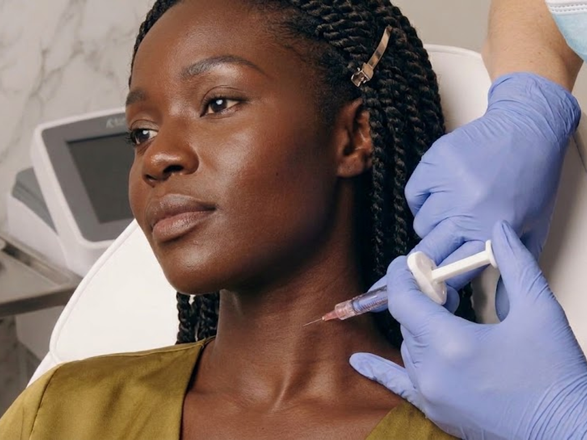 Patient receiving a bio-stimulator neck injection treatment at clinic in Ajax
