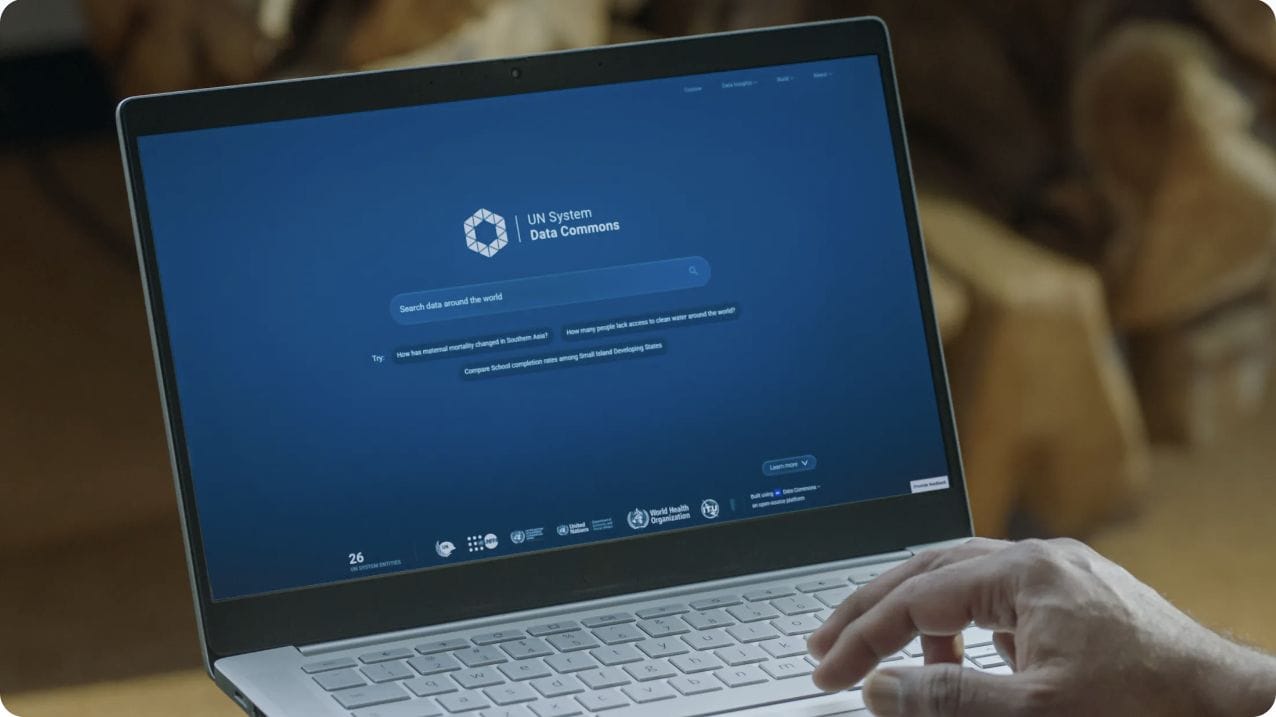 The UN System Data Commons search page displayed on a laptop.