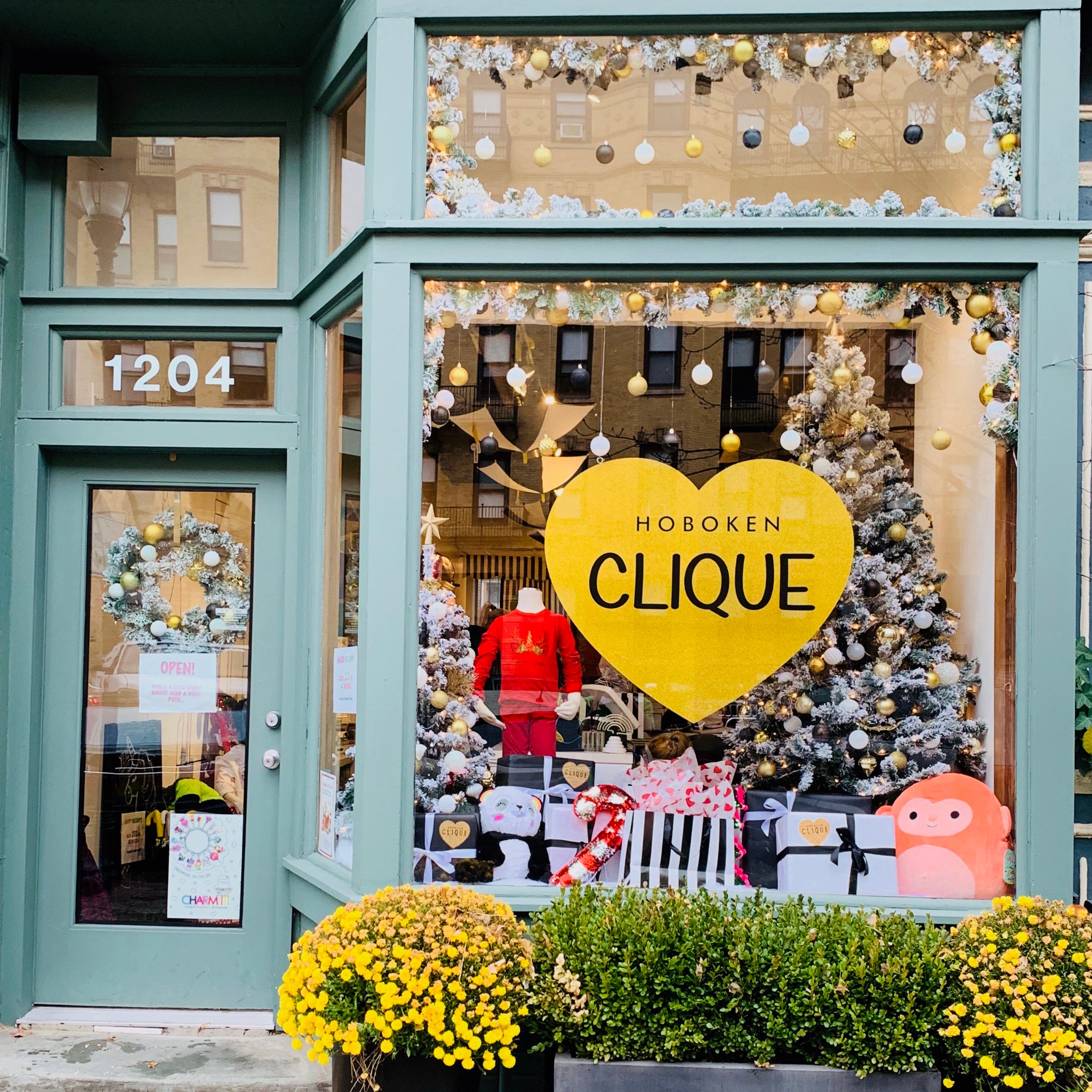 Retail store decorated with flocked Christmas greenery