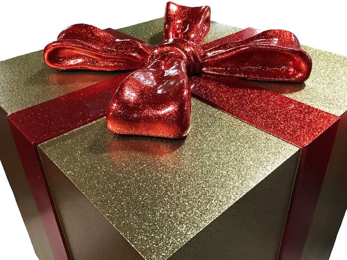 Oversized fiberglass gift box in gold and red glitter paint