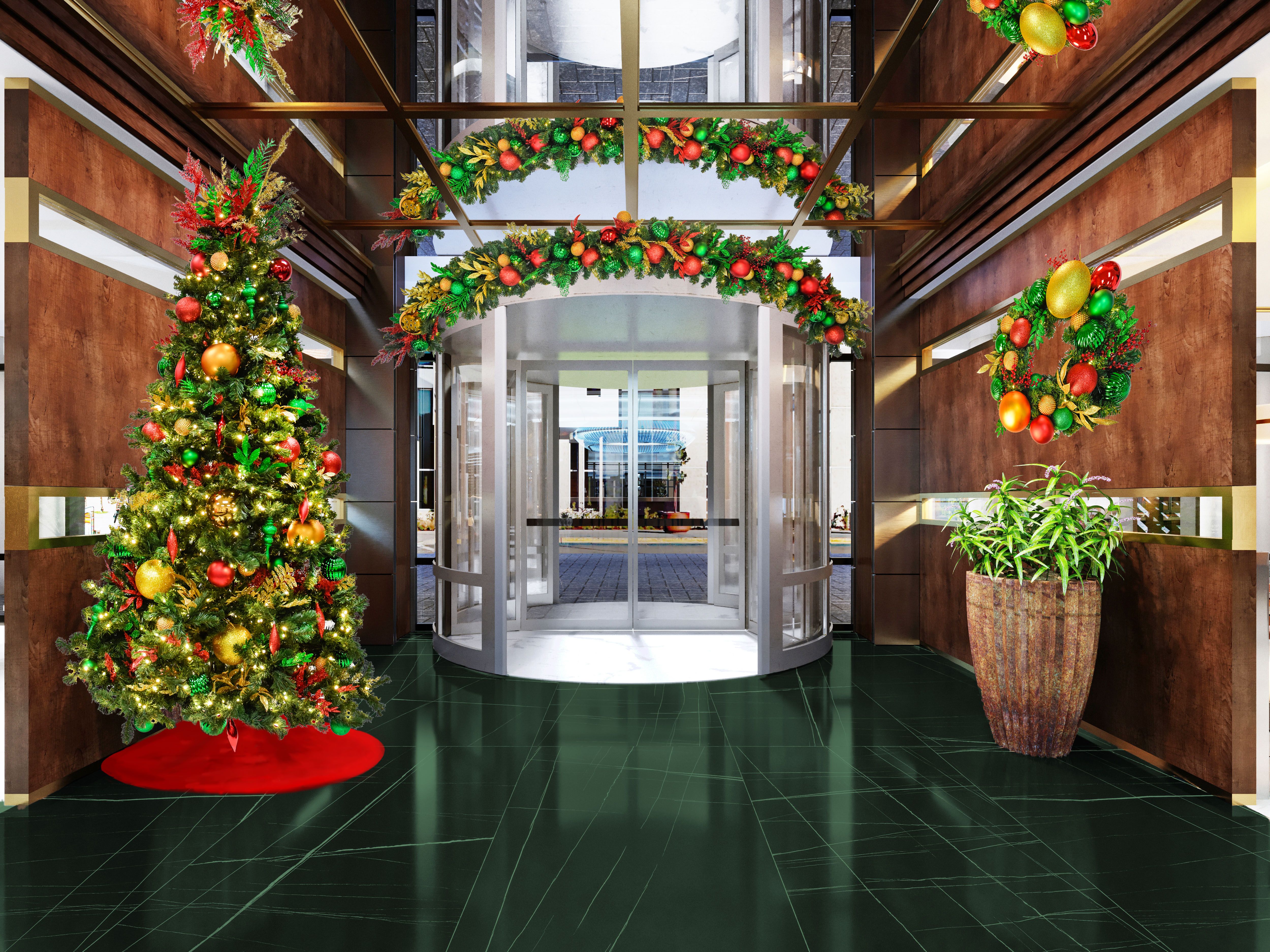 Gold, Green, & Red Christmas tree in building lobby