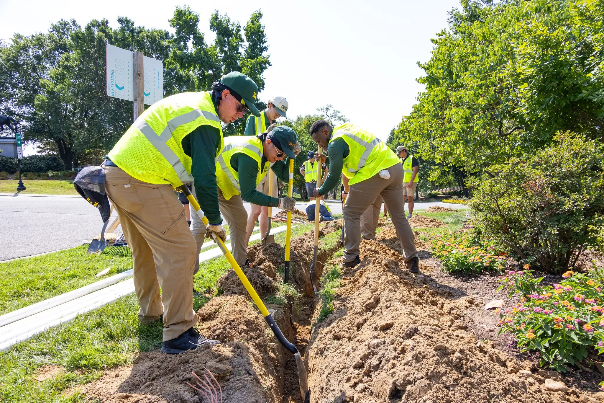 Weed Man Volunteers Tend to Lawn and Landscape at Arlington National Cemetery