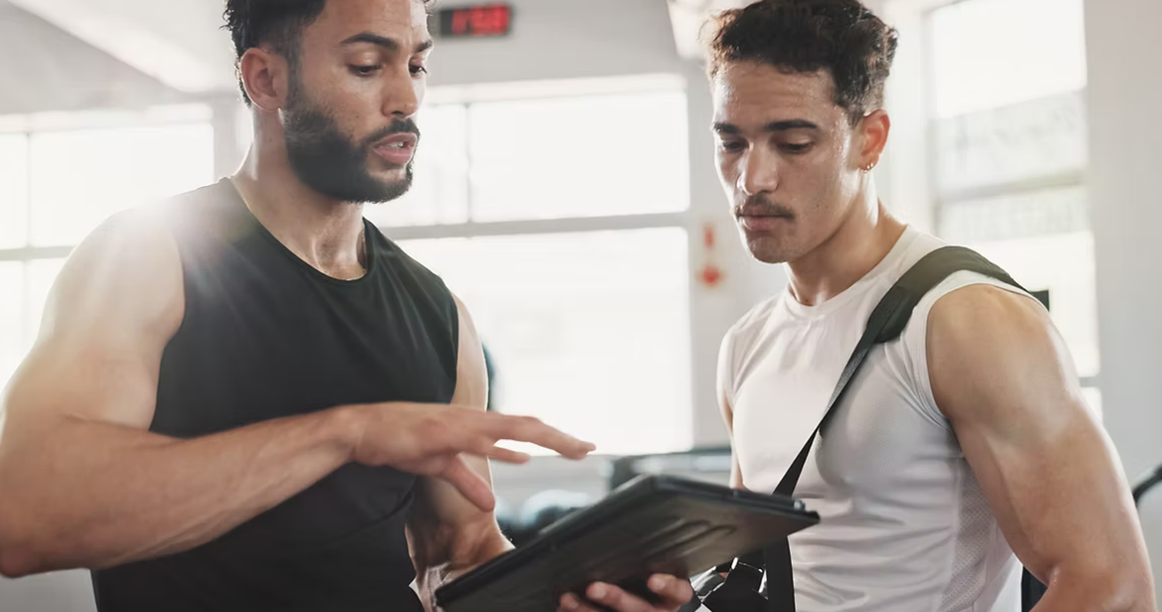 Modern gym interior with workout equipment and open floor space for fitness training