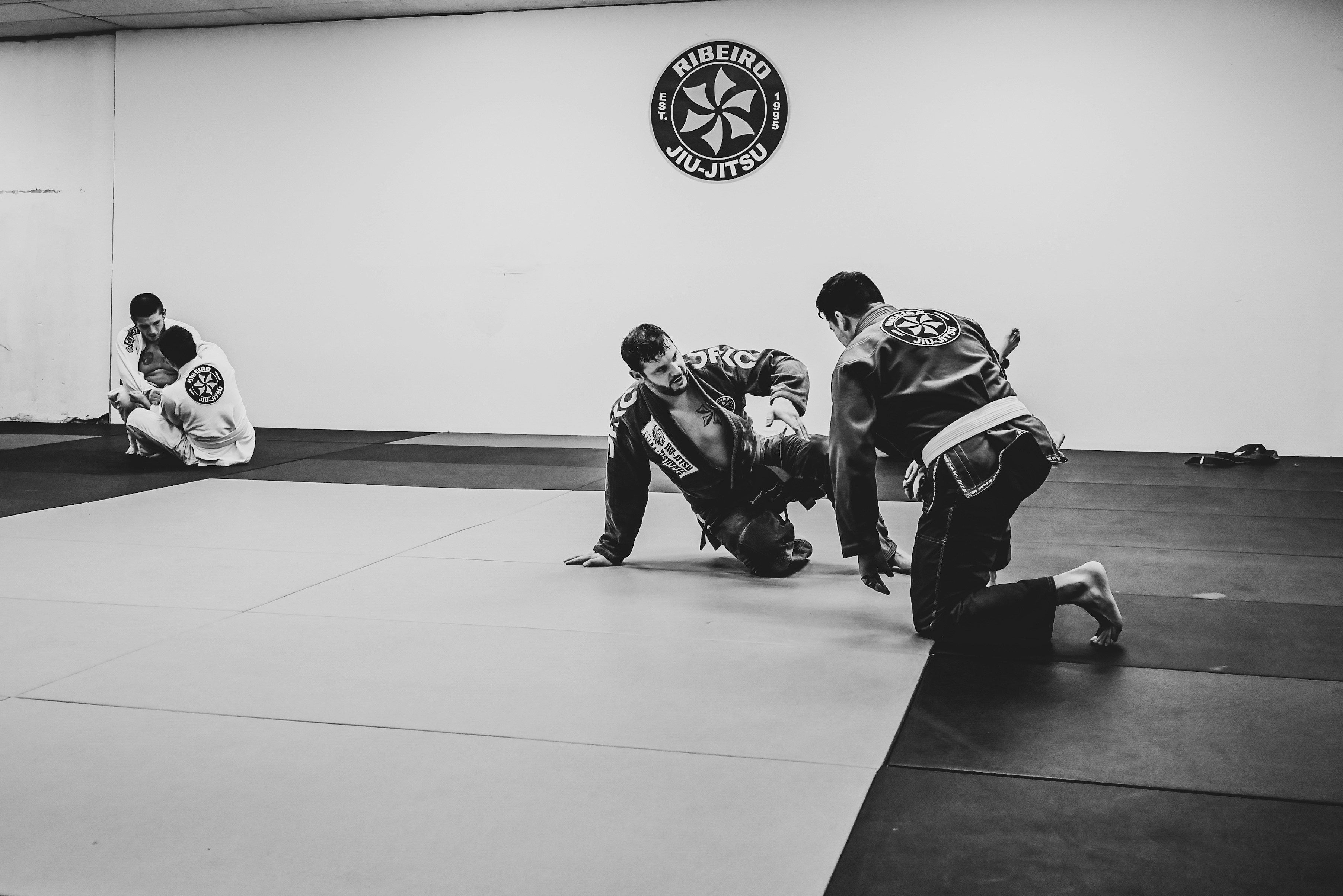 men on a martial arts school mat