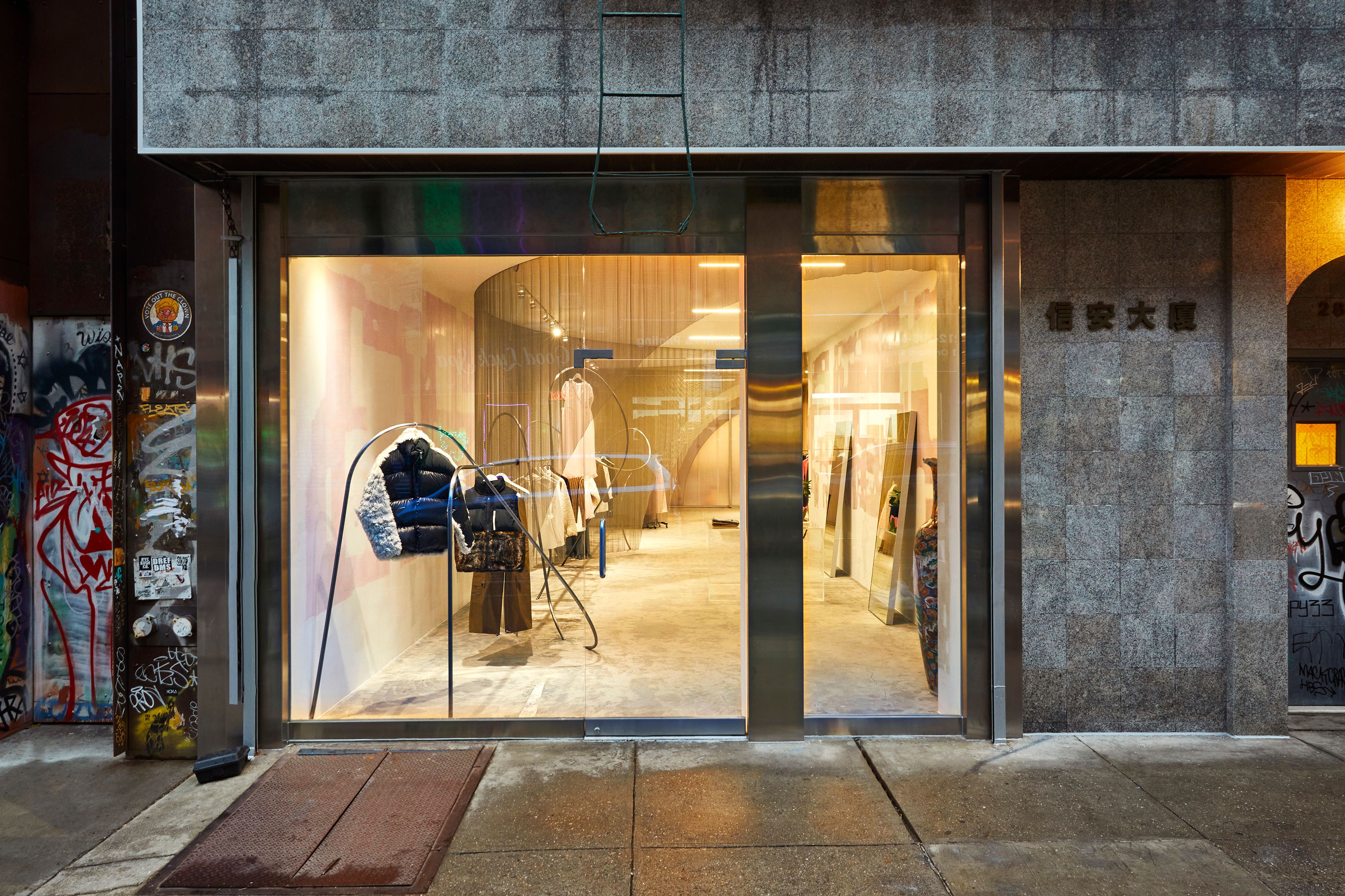 View from street of Sandy Liang Retail store with clothing in the window designed by Almost Studio