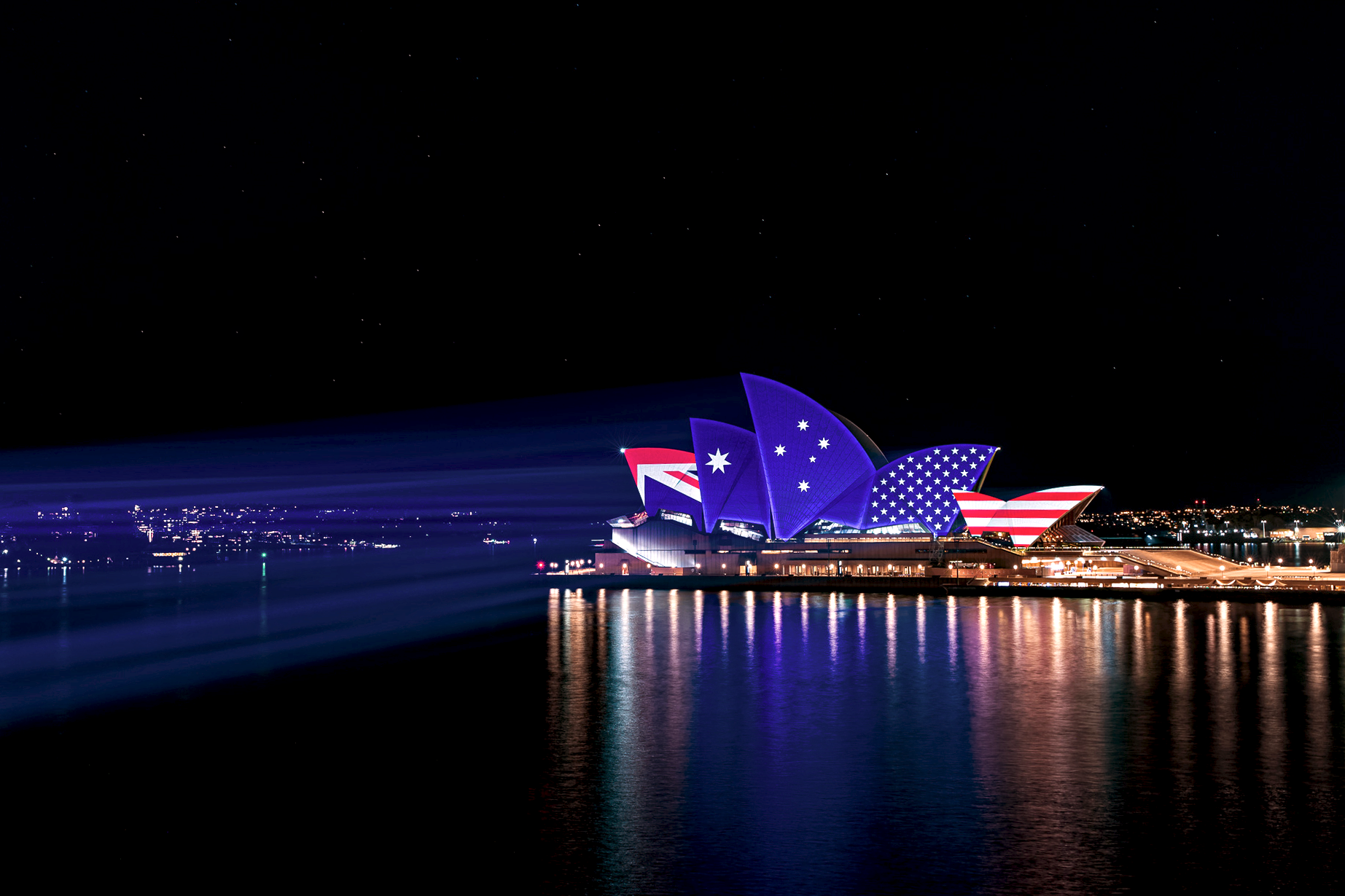 Australian and US flags projected onto the Sydney Opera House