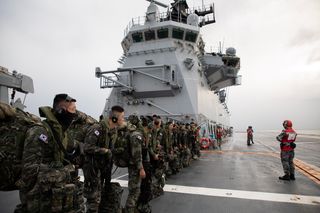 Republic of Korea Marine Corps soldiers on the Flight Deck of HMAS Adelaide during a cross deck from ROKS Marado as part of Exercise Talisman Sabre 23.