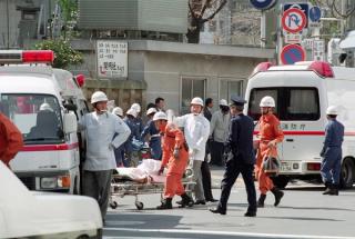 A victim on a stretcher being moved to an ambulance at Tsukiji subway station following a sarin gas attack by doomsday cult Aum Supreme Truth (Aum Shinrikyo) in Tokyo, March 1995.