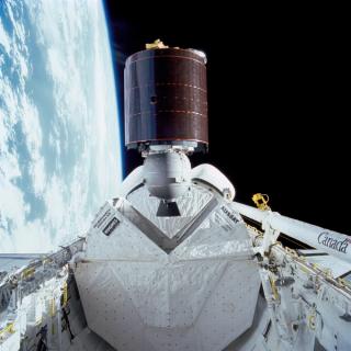 Australia’s AUSSAT communications satellite is deployed from the payload bay of the space shuttle Discovery