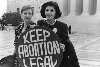 Norma McCorvey, left, who was Jane Roe in the 1973 Roe v. Wade case, with her attorney, Gloria Allred, outside the Supreme Court in April 1989