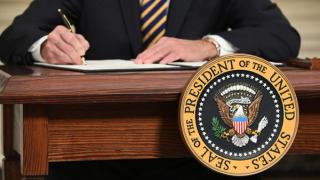 US President Joe Biden signs an executive order at the White House, Washington, DC, February 2021