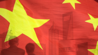 china-flag-businessmen-header-GettyImages-86176544.png