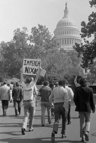 Demonstrators in Washington DC demanding that Congress impeach President Nixon, following the "Saturday Night Massacre"