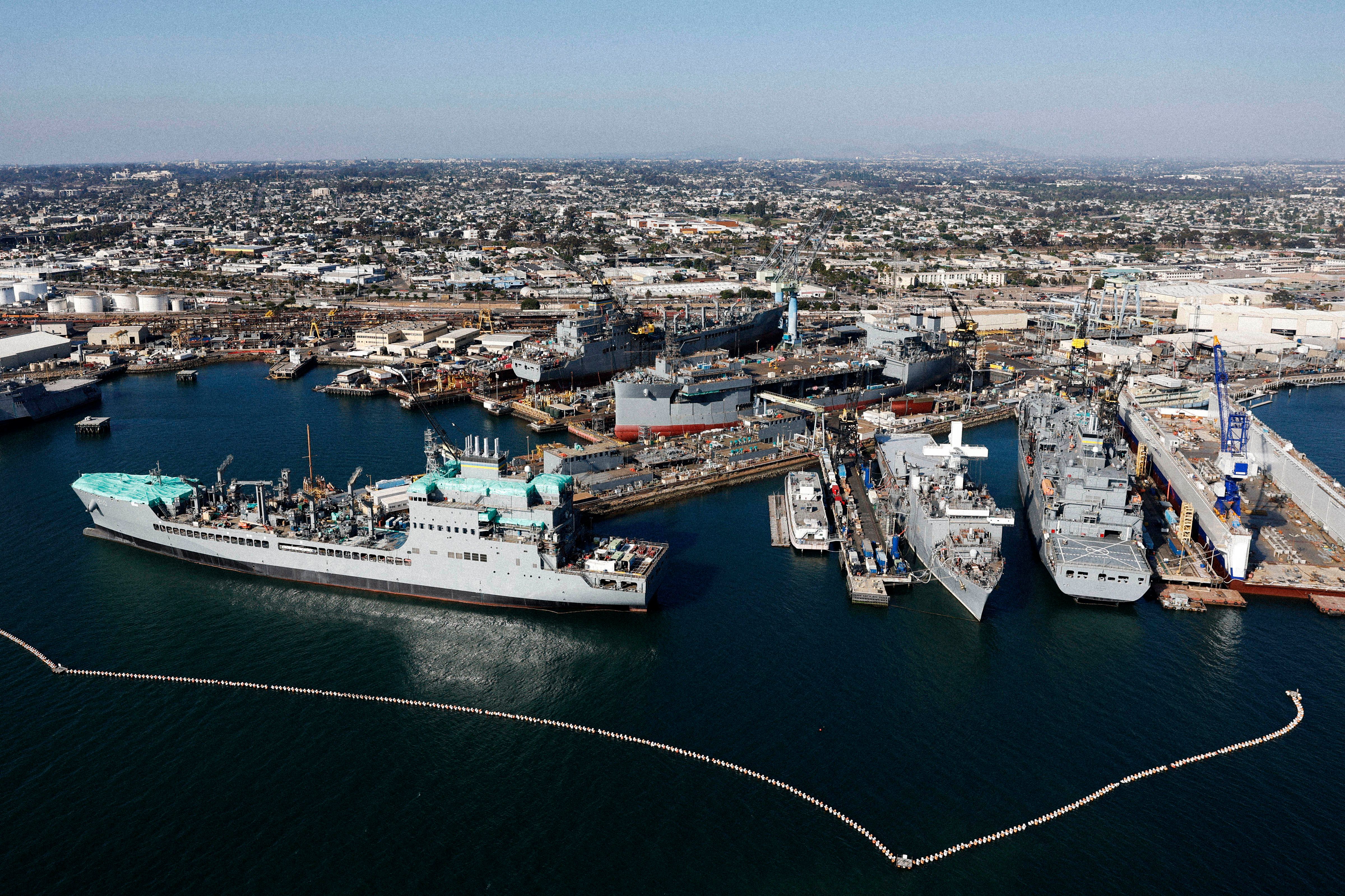 Shipyard with docked ships taken from aerial view.