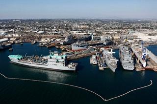 Shipyard with docked ships taken from aerial view.