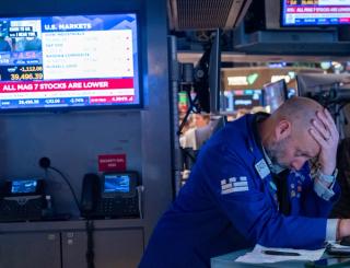 Traders work on the floor of the New York Stock Exchange in April 2025.