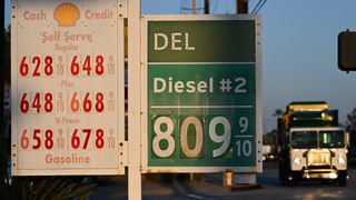 US-ECONOMY-DIESEL A garbage truck drives past gas prices above $6 a gallon and diesel prices above $8 a gallon as they are displayed outside of a Shell gas station in Carson, California on September 22, 2026. On September 22, US President Donald Trump expressed support for a diesel export ban, with fuel prices having surged on the back of the Middle East war.