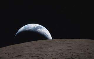 Earthset captured through the Orion spacecraft window on 6 April 2026, during the Artemis II crew’s flyby of the Moon.