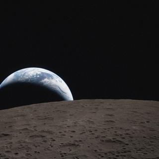 Earthset captured through the Orion spacecraft window on 6 April 2026, during the Artemis II crew’s flyby of the Moon.