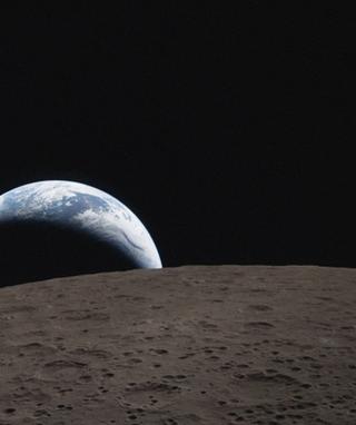 Earthset captured through the Orion spacecraft window on 6 April 2026, during the Artemis II crew’s flyby of the Moon.