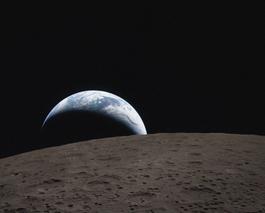 Earthset captured through the Orion spacecraft window on 6 April 2026, during the Artemis II crew’s flyby of the Moon.