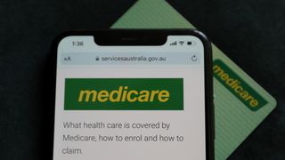 Photo of Australia's medicare website in front of a medicare card