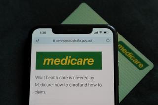 Photo of Australia's medicare website in front of a medicare card