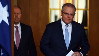 Treasurer Josh Frydenberg and Prime Minister Scott Morrison arrive for a press conference at Parliament House, 14 May 2020