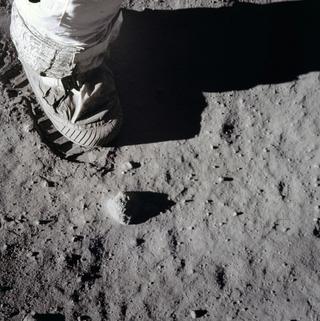 Close-up view of an astronaut’s boot and bootprint in lunar soil, photographed with a 70mm lunar surface camera during the Apollo 11 lunar surface extravehicular activity, 1969