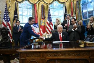 US President Donald Trump shakes hands with US Ambassador to India Sergio Gor in the Oval Office in November 2025.