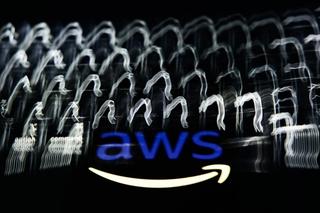 A laptop keyboard and AWS logo in a multiple exposure photo.