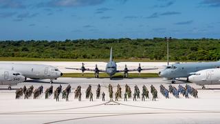Members of the Royal Australian Air Force, US Navy, Japan Maritime Self-Defense Force, Indian Navy and the Royal Canadian Air Force pose for a photo at the conclusion of Exercise Sea Dragon, Andersen Air Force Base, Guam, January 2021