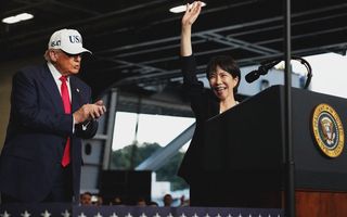 U.S. President Donald Trump applauds as Japanese Prime Minister Sanae Takaichi speaks to troops aboard USS George Washington at Fleet Activities Yokosuka on October 28, 2025 in Yokosuka, Japan. Trump is visiting Japan, fresh off an appearance at the ASEAN summit in Malaysia, and will next travel to South Korea for the APEC meetings.