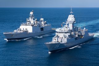 Indian Navy ship INS Sahyadri and HMAS Toowoomba conduct replenishment at sea approaches as part of a cooperative activity in the Timor Sea