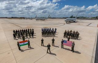 Ground and aircrew from the Indian Navy, the Royal Australian Air Force and the US Navy in front of three Boeing P-8 aircraft at RAAF Base Darwin during Exercise Kakadu 2022