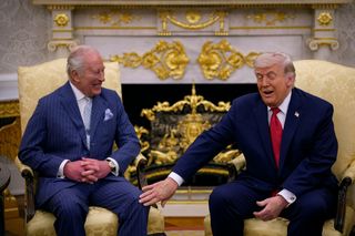 U.S. President Donald Trump (R) touches King Charles III during a meeting in the Oval Office of the White House on April 28, 2026 in Washington, DC.