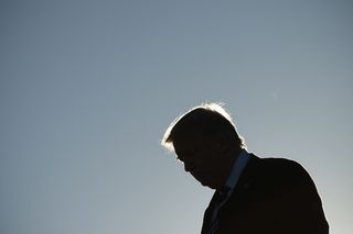 Backlit image of US President Donald Trump