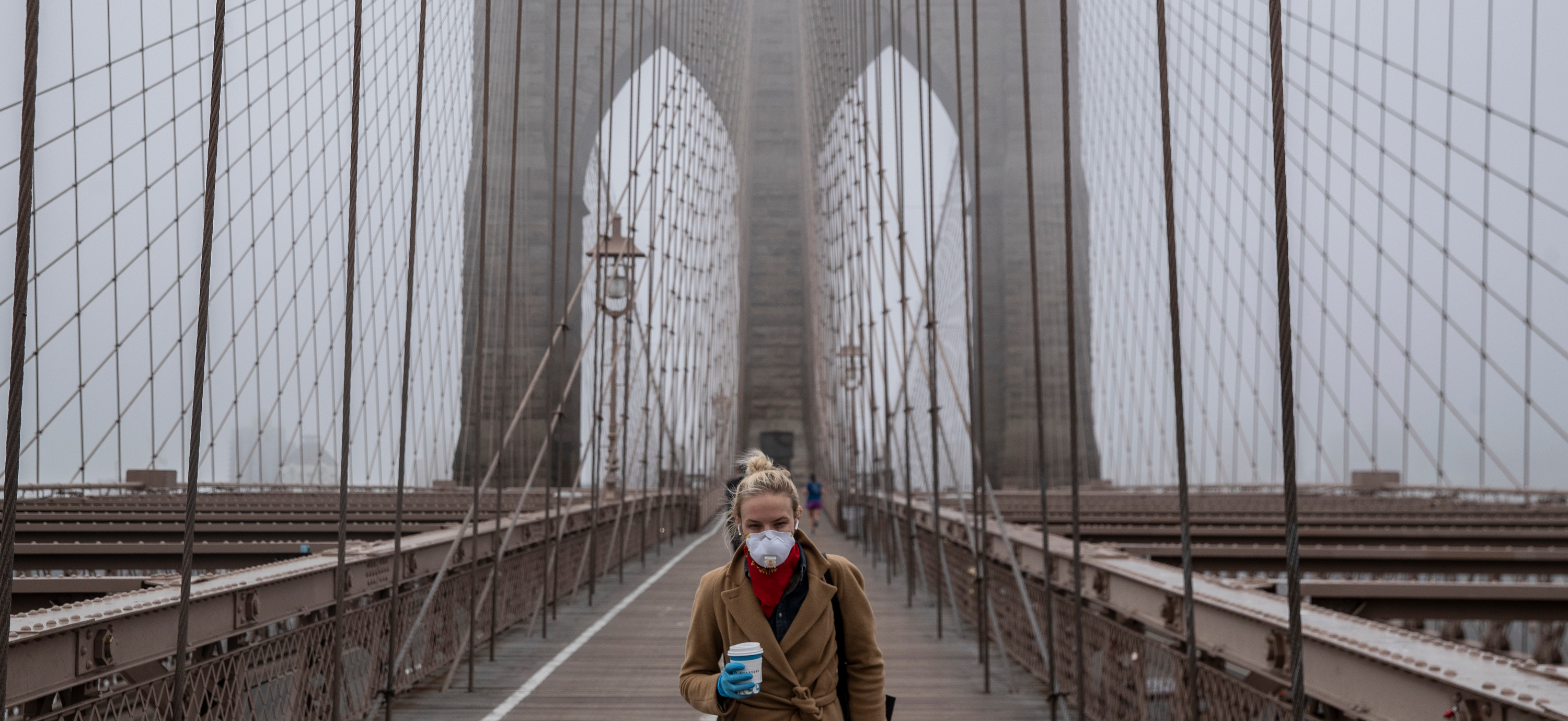 Brooklyn-Bridge-masked-woman-coronavirus-header-GettyImages-1207839451.png