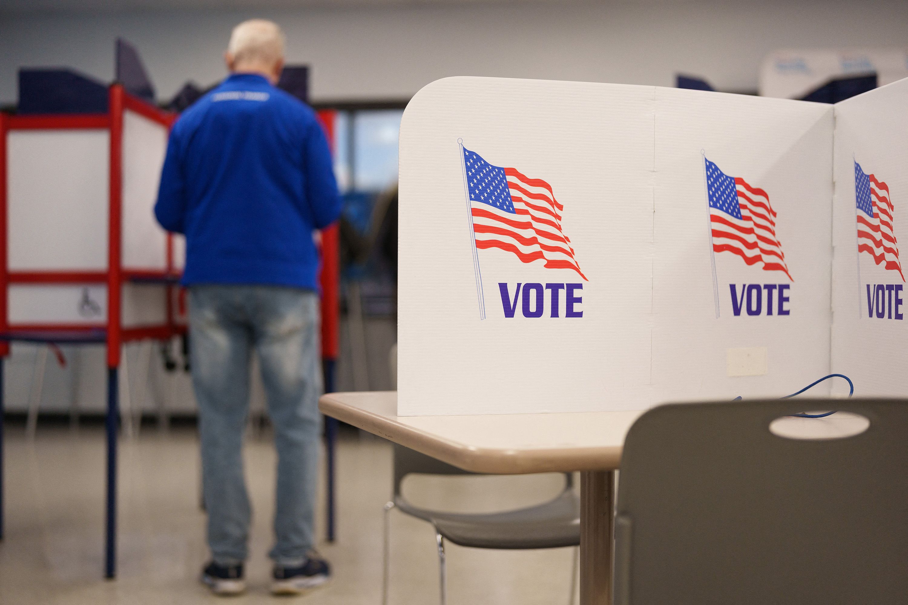 A person fills their ballot during the first day of early voting for the midterm elections in Minneapolis, Minnesota, on October 16, 2026