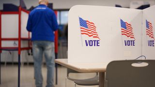 A person fills their ballot during the first day of early voting for the midterm elections in Minneapolis, Minnesota, on October 16, 2026