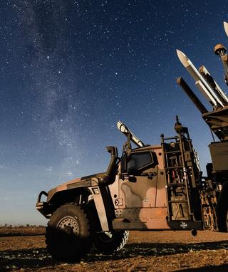 An Australian Army Hawkei High Mobility Launcher loaded with AIM120 AMRAAM training rounds during Exercise Talisman Sabre 2025