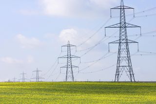 Electricity pylons in a field