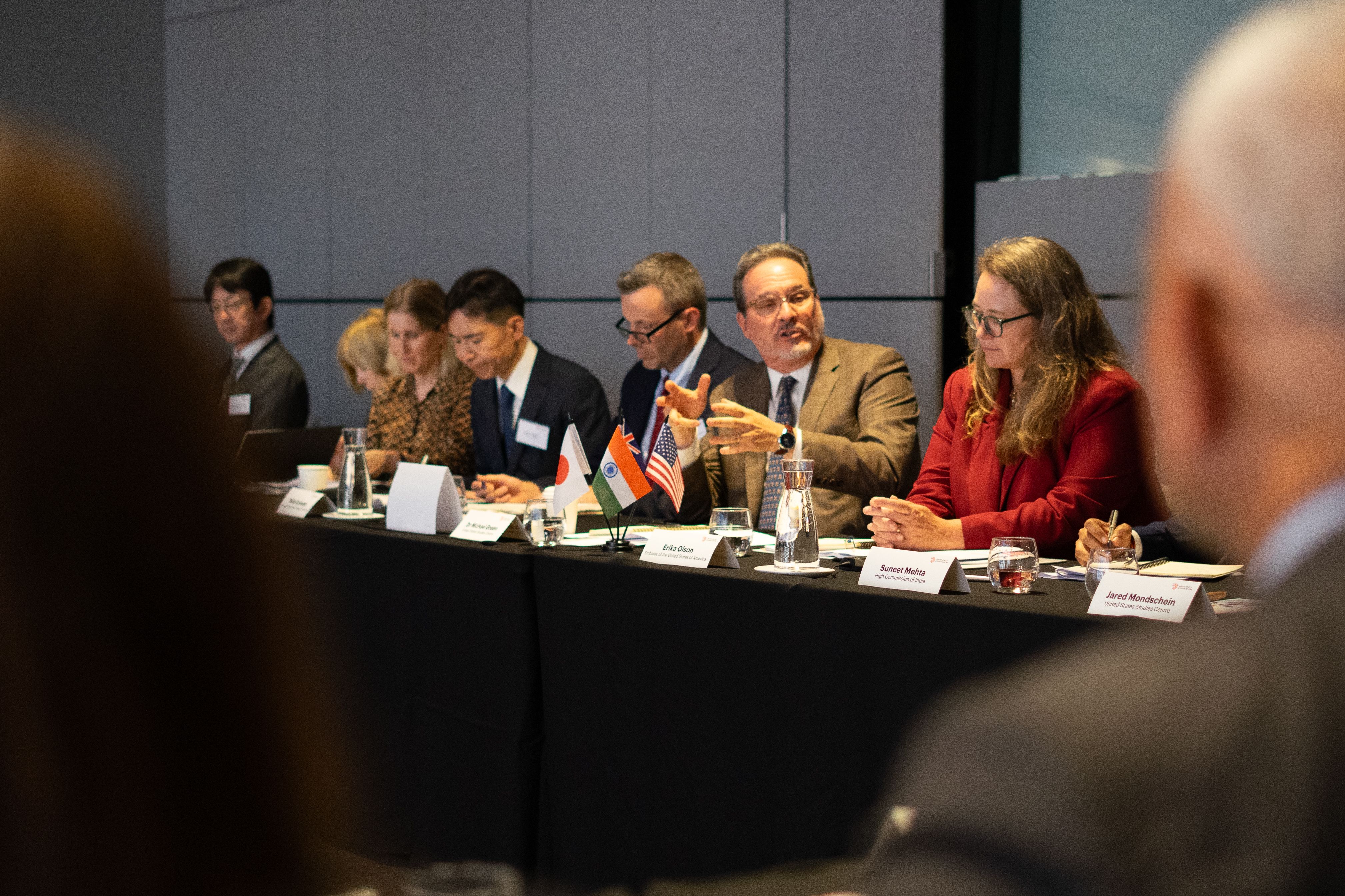 People discussing at a roundtable dialogue event
