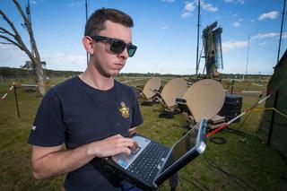 Leading Aircraftman Nick Brown from No. 3 Control and Reporting Unit monitors the satellite link back to RAAF Williamtown from the Corindi showgrounds during Exercise Lightning Storm 20