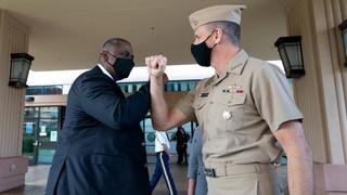 Defense Secretary Lloyd J. Austin III greets Navy Admiral Philip S. Davidson, commander of US Indo-Pacific Command, at Indo-Pacific Command headquarters in Hawaii, March 2021