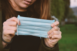 girl-holding-face-mask-canva-stock-image-thumbnail.png