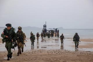 Singapore Armed Forces and Australian Army soldiers disembark a landing craft during Exercise Trident 2022 in Queensland