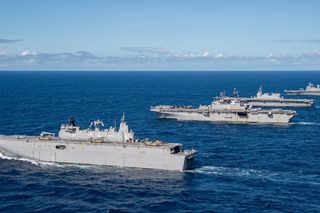 From front) Royal Australian Navy Canberra-class landing helicopter dock ship HMAS Adelaide (L01), United States Navy Amphibious assault carrier USS America (LHA 6), Japan Maritime Self-Defense Force helicopter destroyer JS Izumo (DDH 183), and Republic of Korea Navy amphibious assault ship ROKS Marado (LPH 6112), sail in formation during Exercise Talisman Sabre 2023