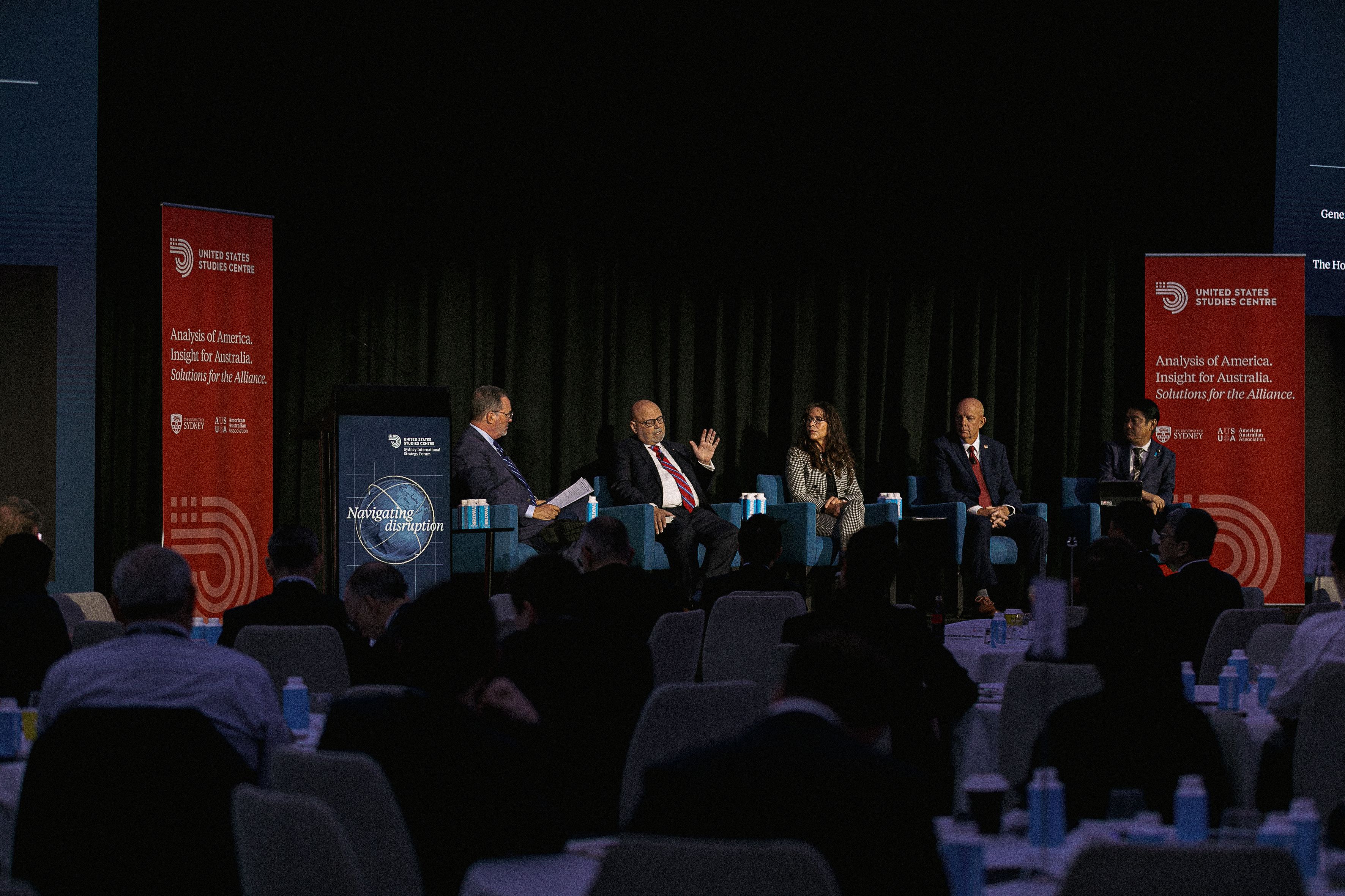 The five panellists speaking on stage at the conference.