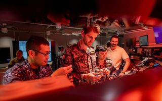 Personnel from the Royal Australian Navy and Japan Maritime Self Defence Force inspect hardware components during Exercise Blue Spectrum, Fleet Cyber Unit, Sydney, May 2024